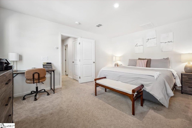 bedroom featuring light colored carpet