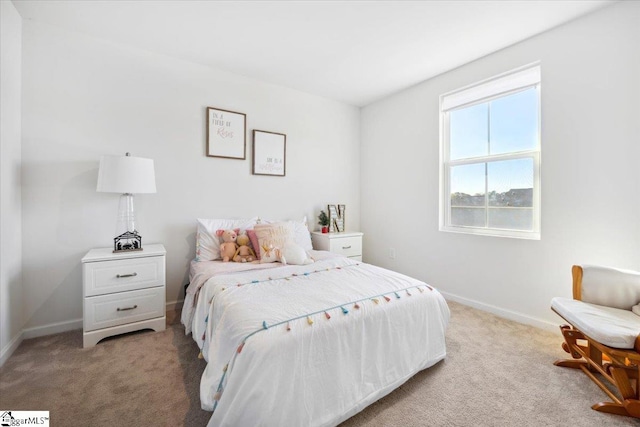 bedroom featuring light carpet