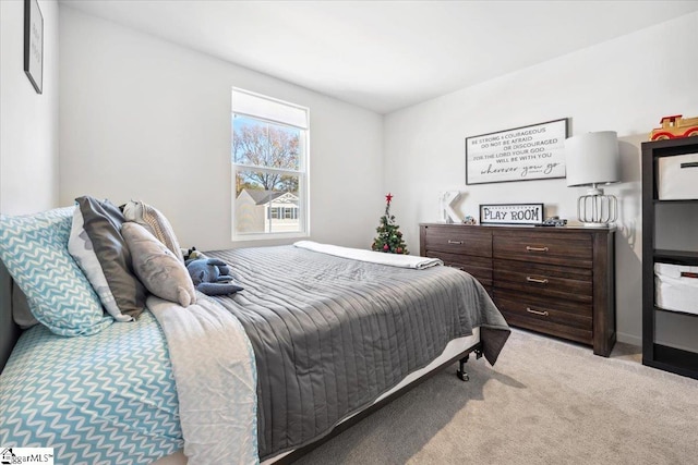 bedroom with light carpet