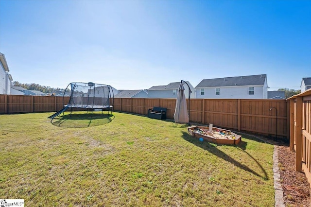 view of yard with a trampoline