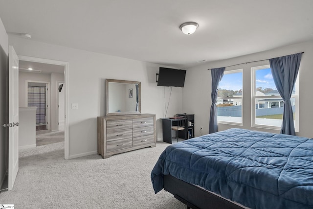 bedroom featuring light carpet