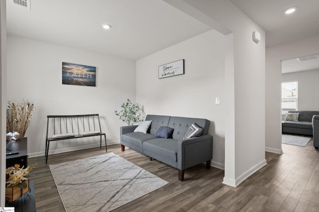 living room featuring dark hardwood / wood-style floors