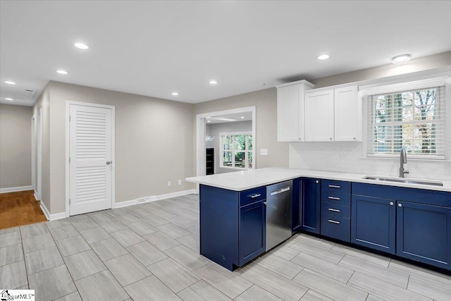 kitchen featuring dishwasher, a healthy amount of sunlight, kitchen peninsula, and sink