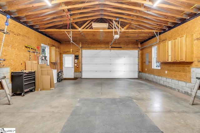 garage with washer / dryer and a garage door opener