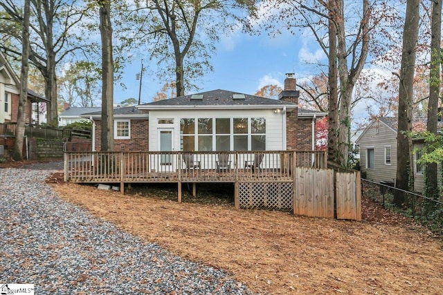 rear view of house with a wooden deck