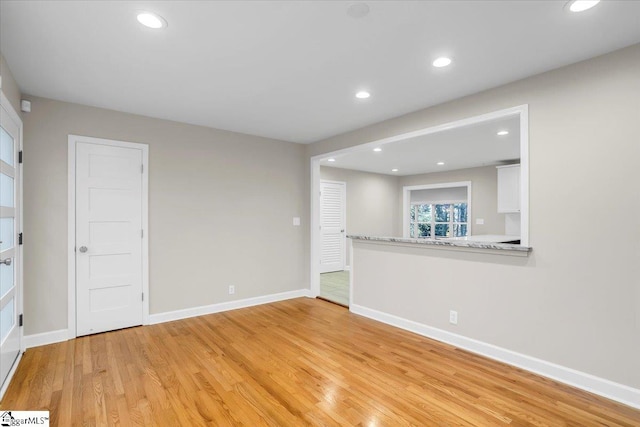 unfurnished living room featuring light hardwood / wood-style flooring