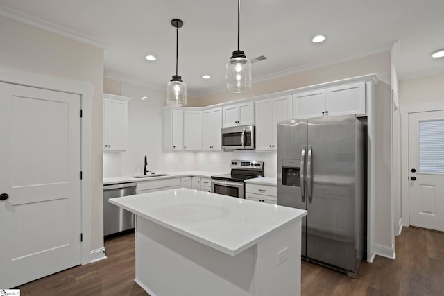 kitchen featuring sink, white cabinets, stainless steel appliances, and dark hardwood / wood-style floors