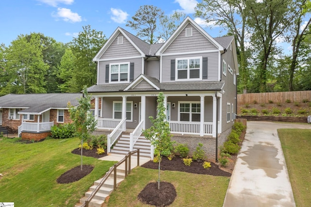 view of front of home featuring a porch and a front yard