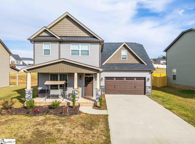 craftsman-style house featuring a porch and a front yard