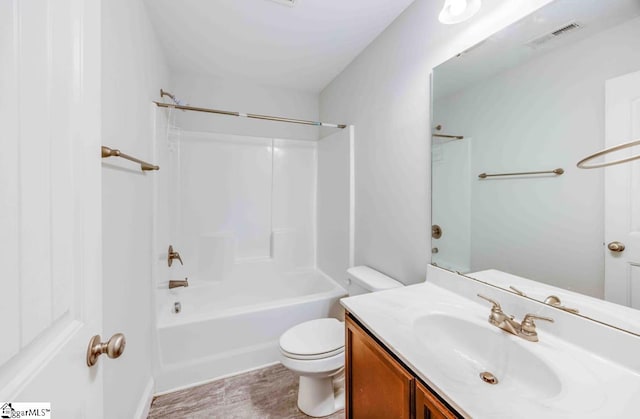 full bathroom featuring vanity, shower / bathtub combination, and toilet