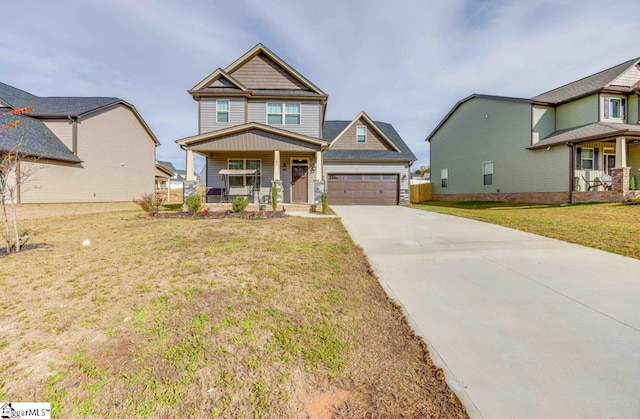 craftsman-style house featuring a front lawn, covered porch, and a garage