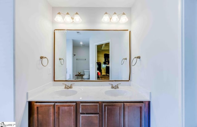 bathroom with vanity and toilet