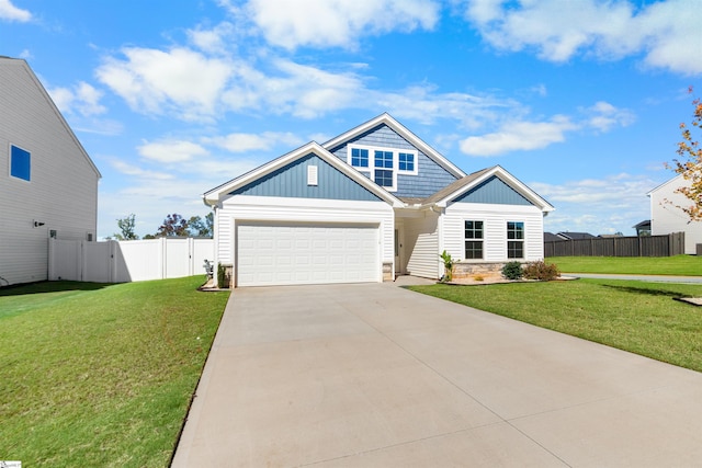 view of front of property with a garage and a front yard