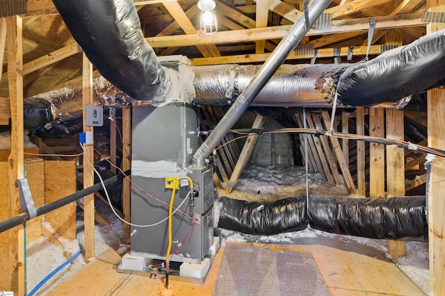 unfinished attic with heating unit