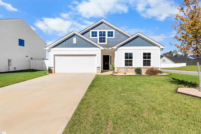 view of front of home featuring a garage and a front yard