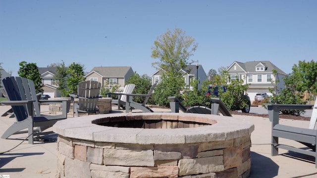 view of patio with a fire pit