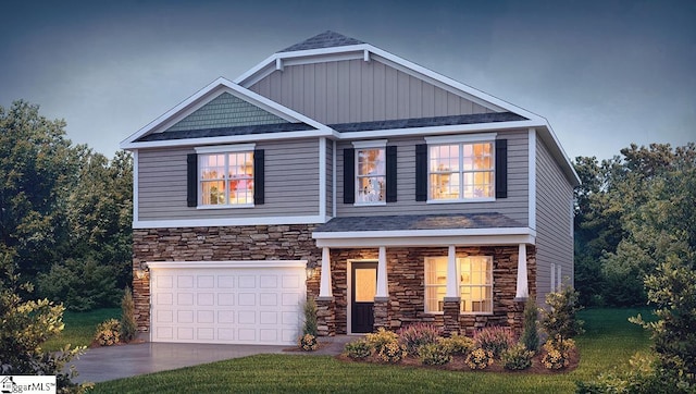 craftsman inspired home featuring a front yard and a garage