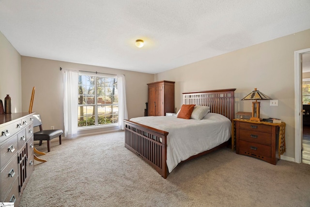 carpeted bedroom with a textured ceiling