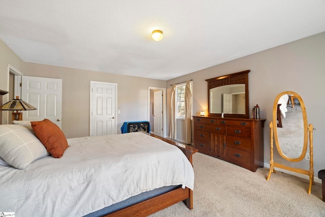 carpeted bedroom with a textured ceiling