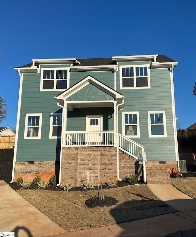 view of front of property featuring covered porch and central air condition unit