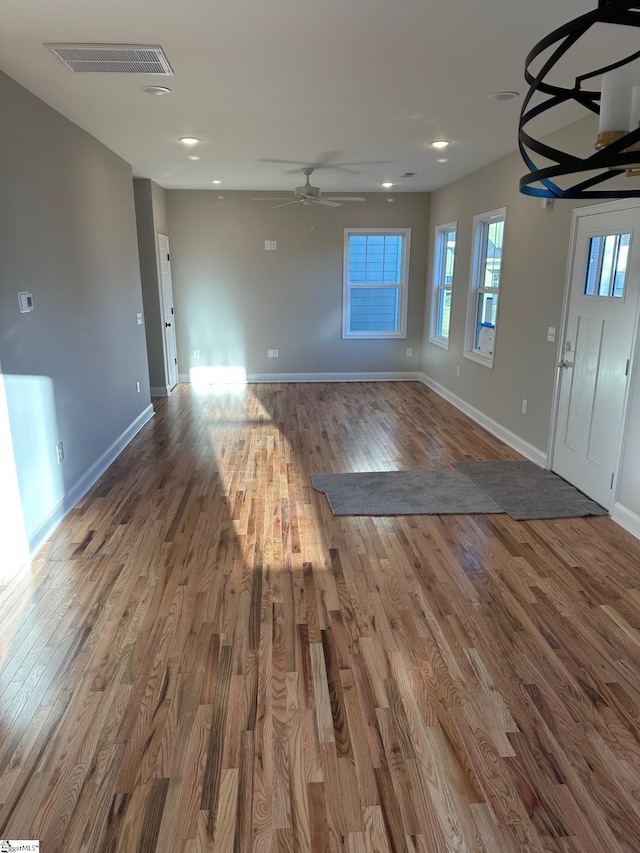 foyer entrance featuring ceiling fan and hardwood / wood-style flooring