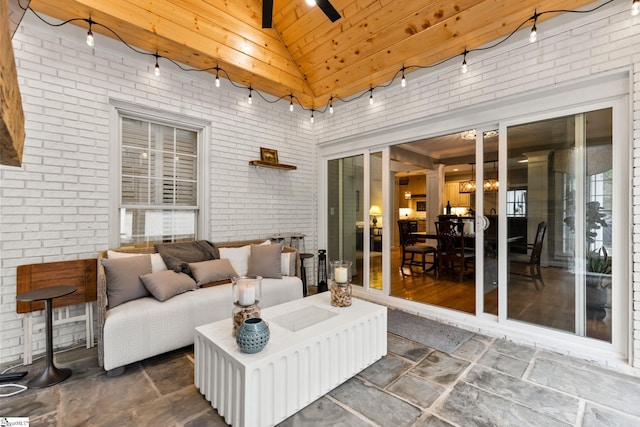 sunroom / solarium featuring wood ceiling, ceiling fan, lofted ceiling with beams, and track lighting