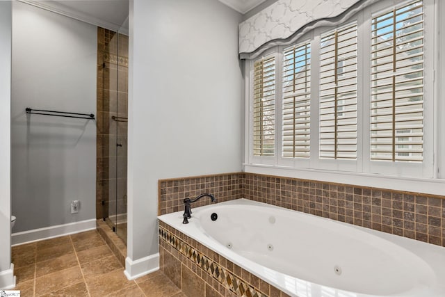 bathroom featuring independent shower and bath and ornamental molding