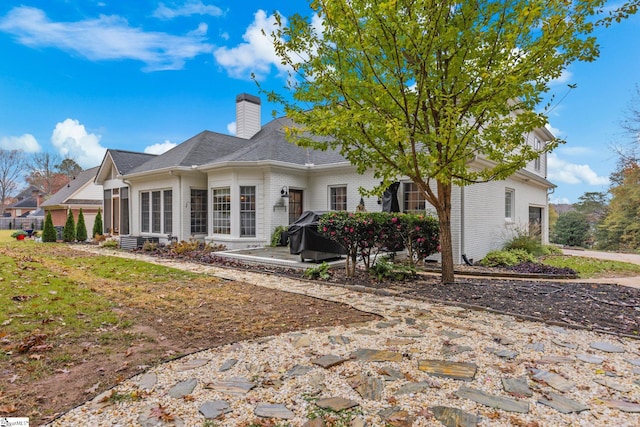 back of property featuring a patio