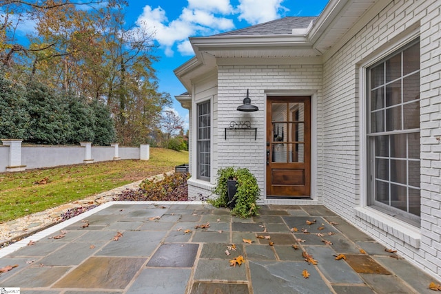 property entrance with a patio area