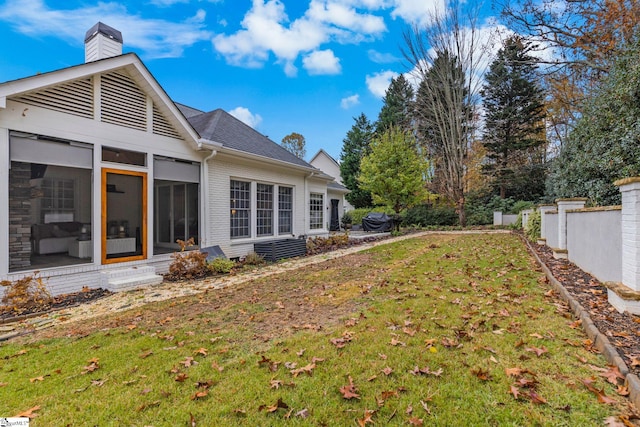 view of yard with a sunroom