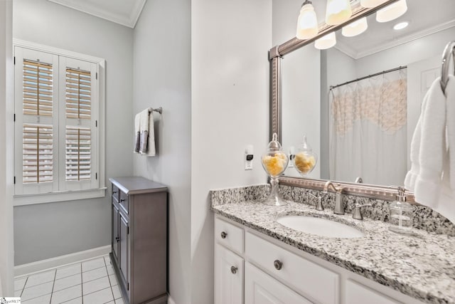 bathroom featuring tile patterned floors, vanity, and ornamental molding