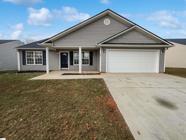 ranch-style home with a garage and a front lawn