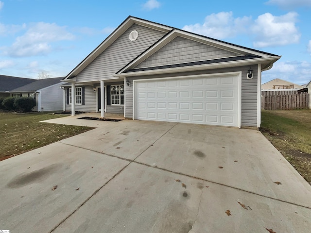 ranch-style home featuring a garage