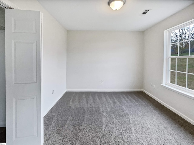 view of carpeted spare room