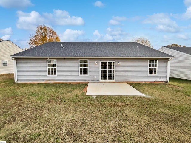 back of house with a yard and a patio area