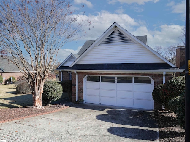 view of side of property featuring a garage