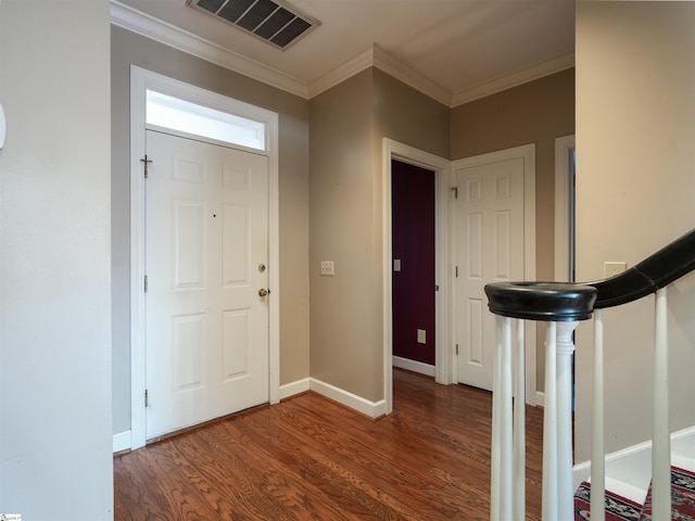 foyer with dark hardwood / wood-style flooring and crown molding