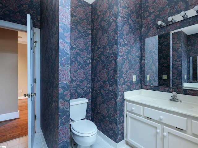 bathroom with tile patterned floors, vanity, and toilet