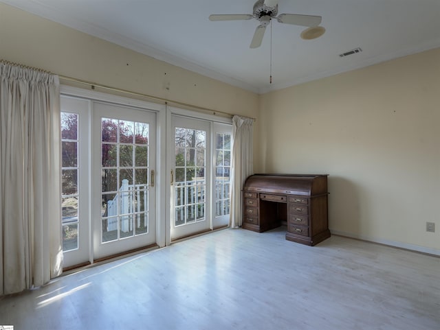 doorway featuring ceiling fan, light hardwood / wood-style floors, and ornamental molding