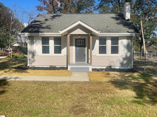 bungalow with a front lawn