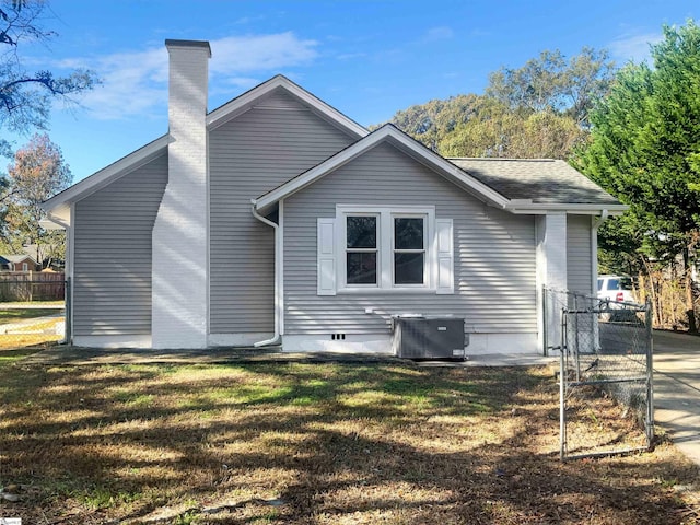 105 Duncan Ave, Greer, SC 29651 - rear view of house featuring central air condition unit, a chimney, and a gate