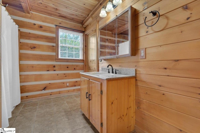 bathroom with vanity, wooden ceiling, and wood walls