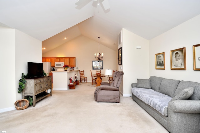 carpeted living room featuring ceiling fan with notable chandelier and lofted ceiling