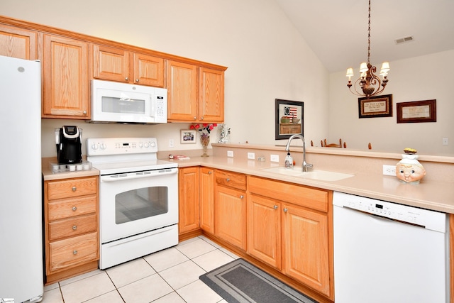 kitchen with sink, an inviting chandelier, pendant lighting, white appliances, and light tile patterned flooring