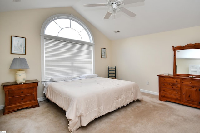 carpeted bedroom with ceiling fan and lofted ceiling