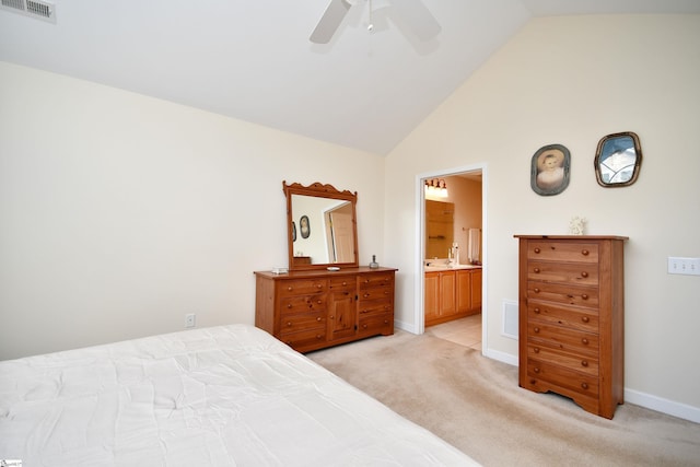 bedroom with ensuite bathroom, ceiling fan, light carpet, and high vaulted ceiling