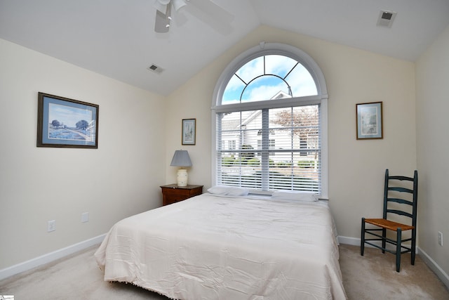 carpeted bedroom featuring ceiling fan and vaulted ceiling