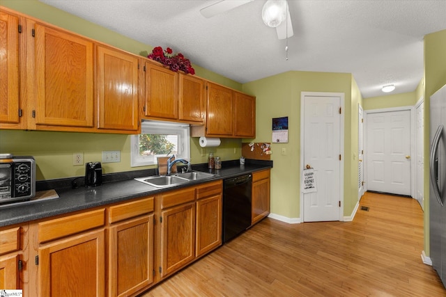 kitchen with dishwasher, sink, ceiling fan, a textured ceiling, and light hardwood / wood-style floors