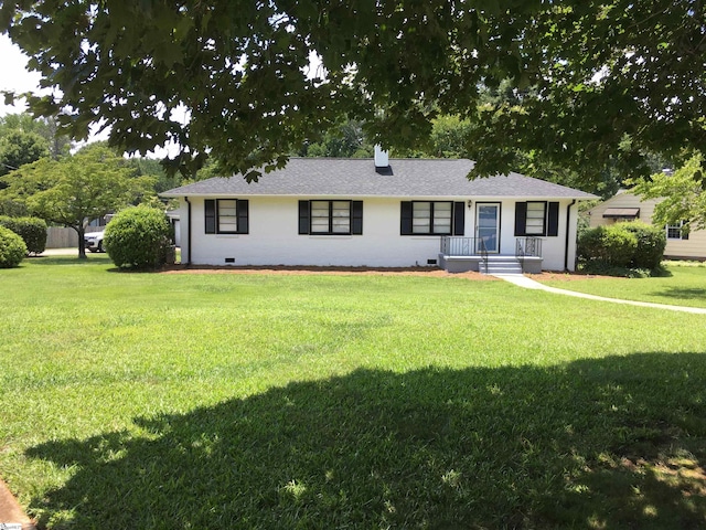 ranch-style house featuring a front lawn