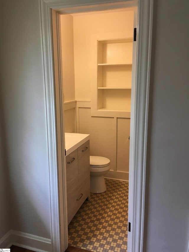 bathroom featuring vanity and toilet